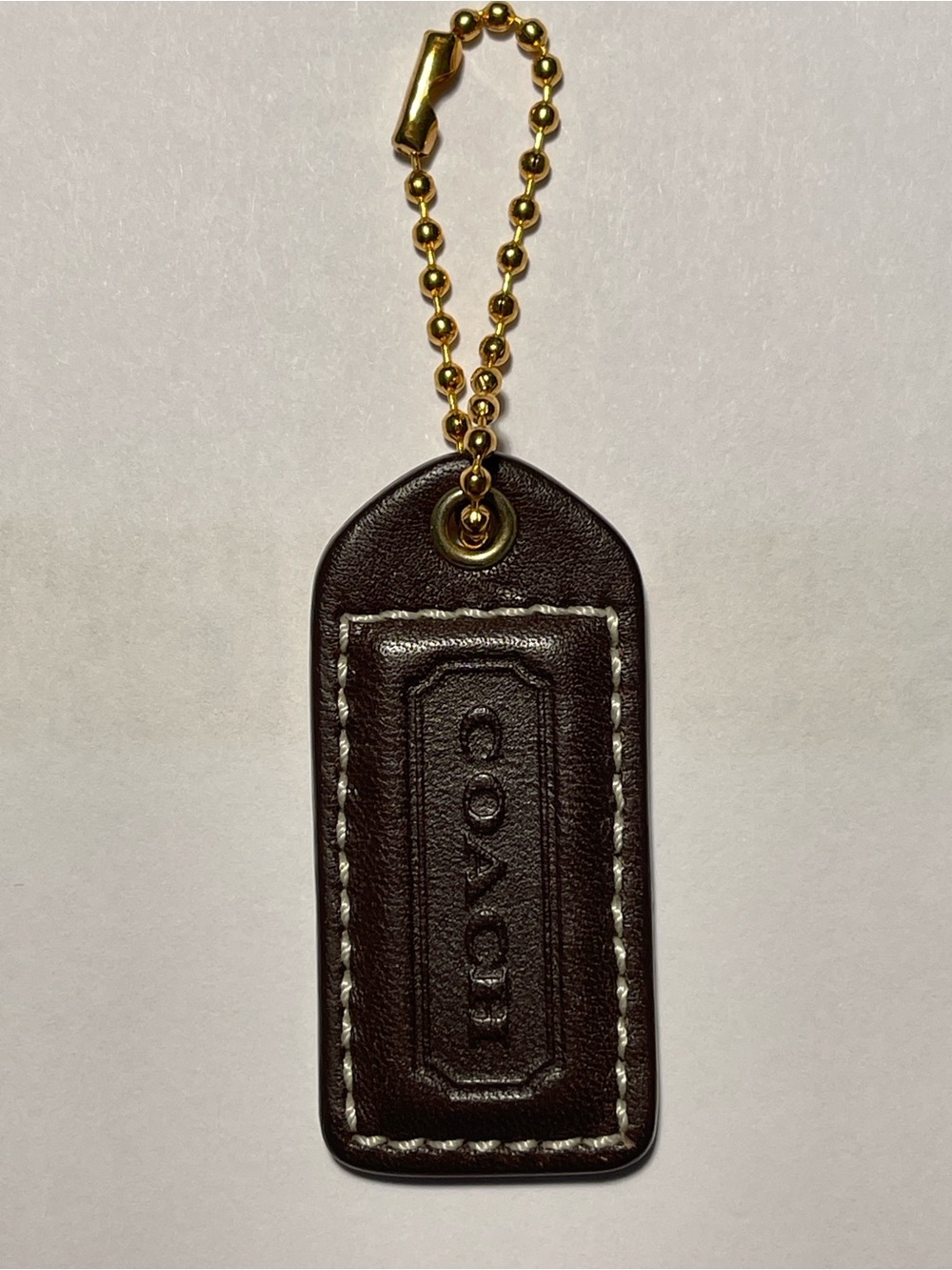 Coach Dark Brown Leather Hang Tag with Gold Chain and White Stitching